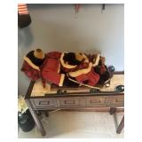 Doll sled with three teddy bears