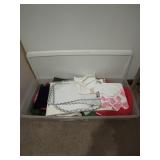 Plastic container with several wonderful linens