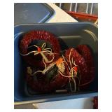 Christmas wreaths with lights in a tote