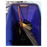 A tote with tools, drill, saws, etc.