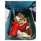 Tote full Christmas tree, skirts, Santas, and