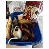A tote with trays plates and bottles
