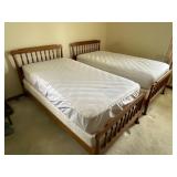 Pair of vintage twin beds with mattresses