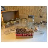 Ball jar with marbles, jars, matchbooks