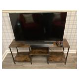 Samsung TV and Roko remote, stand