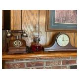 Seth Thomas mantle clock, oil lamp, and phone