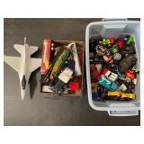 Assorted die-cast toy cars and plane