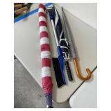American flag, umbrellas, and vehicle snow brush