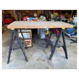 Tall saw horses and wood top