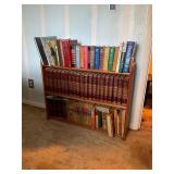 Assorted books and shelf