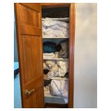 Assorted bed linens -two closets