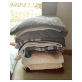 Assorted blankets and bed spread