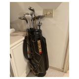 Michelin golf bag and assorted clubs