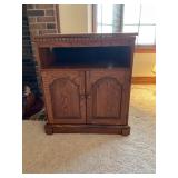 Black and swivel top wood Tv stands