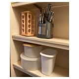 Assorted plastic containers, spice rack, knives