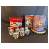 Candle, votive cups with candles, tin cans