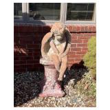Concrete angel on pedestal