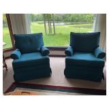 Pair of swivel rocking chairs