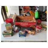 Assorted Coca-Cola tins and wagon