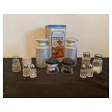 Assorted salt and pepper shakers, cracker tin