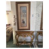 Hall table, picture, and wall sconce.