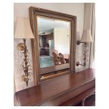 Beveled mirror and wall lamps