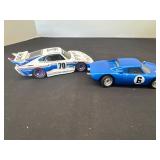Two signed toy race cars, plastic