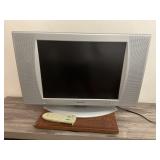 19 in. Sharp tv with remote on swivel base