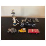 Assorted cars and gas pump