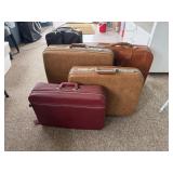 Assorted suit cases