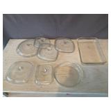 Assorted Corningware lids and Pyrex bakeware