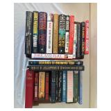 Assorted books and over the bed light