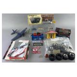Group of toy cars, model parts, stickers,