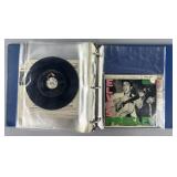 14 Elvis Presley 45's in binder