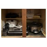 Contents of lower kitchen cabinet, Foodsaver,