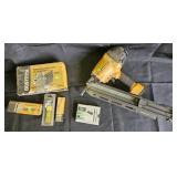 Bostich Magnesium pneumatic nail gun and boxes of