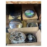 Group of hubcaps, mower tires, brake assemblies
