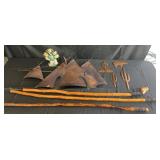 Group of walking sticks, copper wall decor and