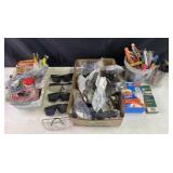 Group of safety glasses, gloves, markers,