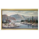 Framed wall art depicting western landscape,