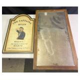 Wall mirror and ï¿½The Captainï¿½s Rulesï¿½ sign,