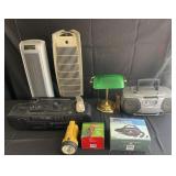 Group of radios, air pumps, fans, desk lamp and