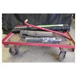 Red, metal garden cart w/ rolls of landscape
