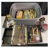 Group of painting supplies: brushes, trays,