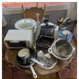 Group of kitchen appliances, knife set, pots,