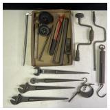 Group of pry bars, wrenches, scales, drills and