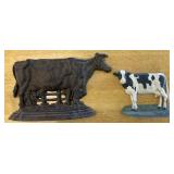 2 cast iron cow door stops