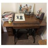 Singer sewing machine, cabinet, sign, book &
