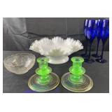 Pair of uranium glass candlesticks and decorated