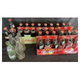 Collection of Coca-Cola and soda bottles, 33 are